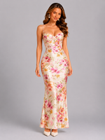 Woman wearing a floral dress on a gray background