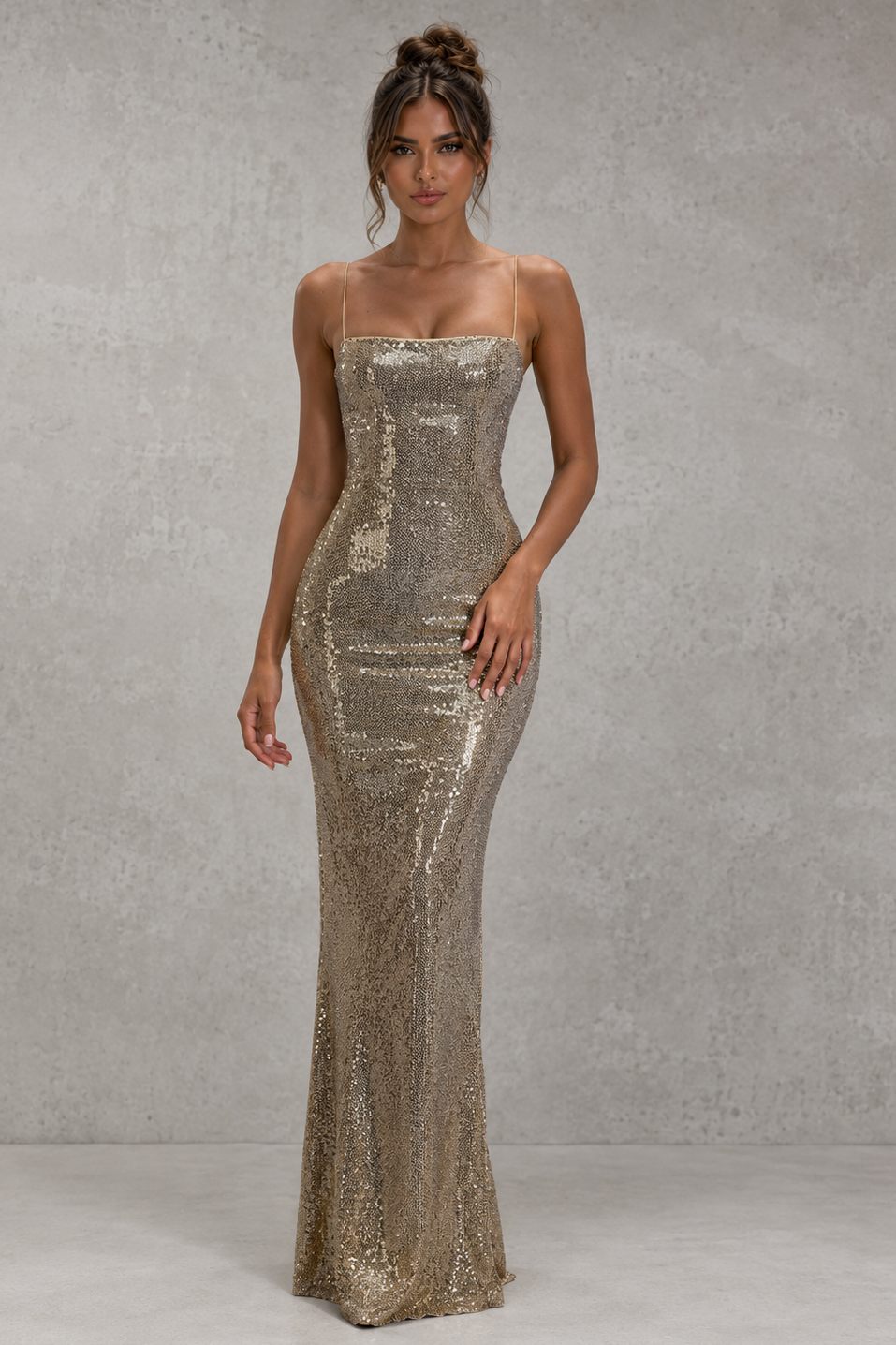 Woman wearing a sparkly strapless gown against a neutral background