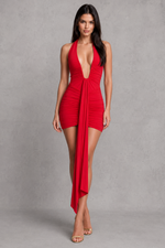 Woman wearing a red dress against a gray background