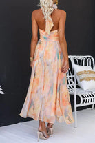 Women’s halter neck maxi dress with watercolor print and open back