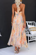 Women’s halter neck maxi dress with watercolor print and open back
