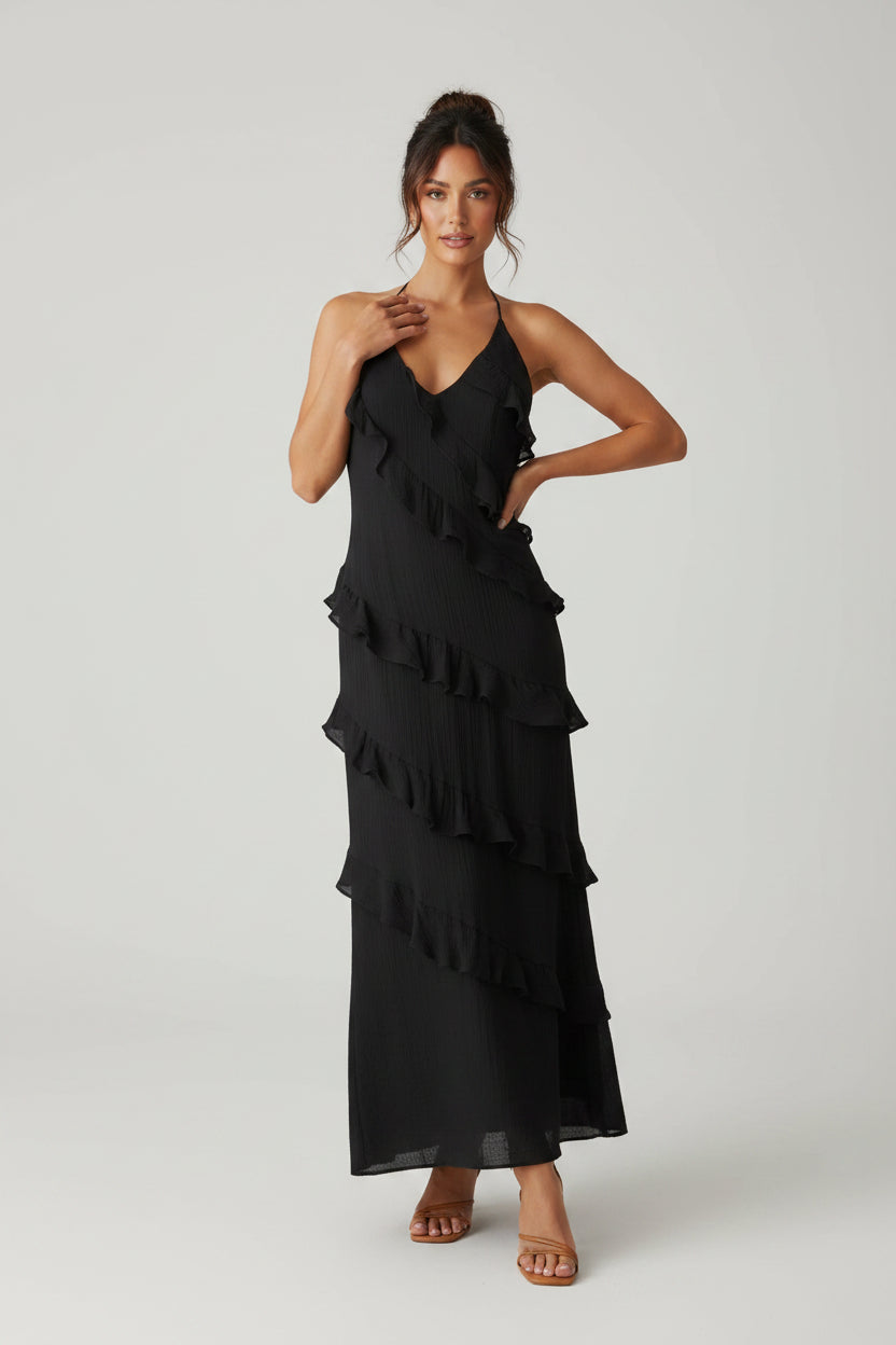 Women’s halter neck maxi dress with ruffle details and flowing silhouette