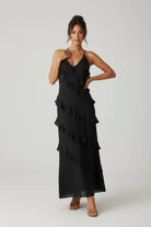 Women’s halter neck maxi dress with ruffle details and flowing silhouette