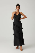 Women’s halter neck maxi dress with ruffle details and flowing silhouette
