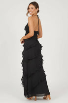 Women’s halter neck maxi dress with ruffle details and flowing silhouette