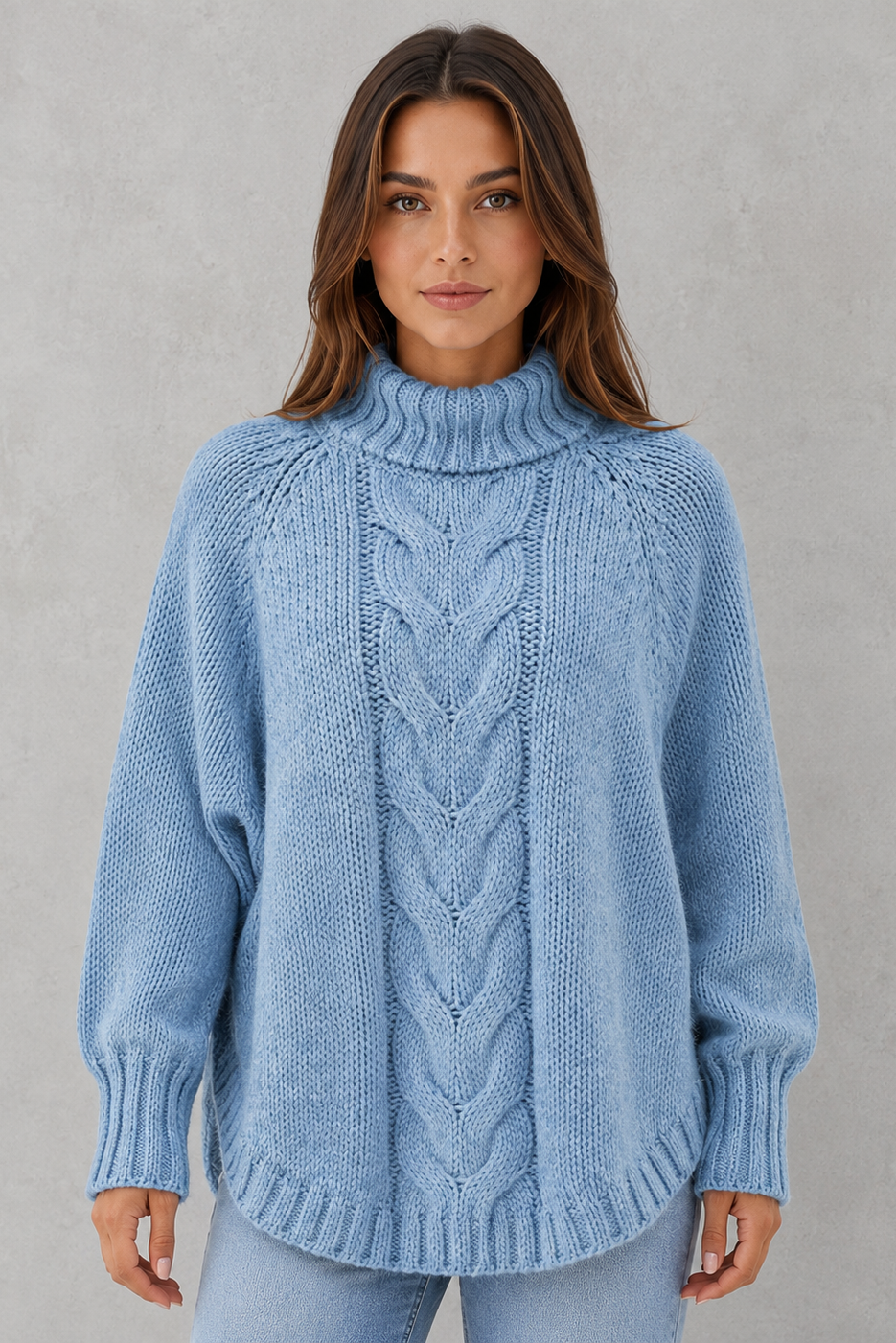 Woman wearing a blue knitted sweater against a gray background