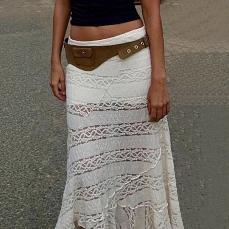 Person wearing a white lace skirt with a brown belt on a gray background
