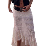 Person wearing a white lace skirt on a plain background