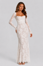 Woman wearing a white lace dress on a gray background