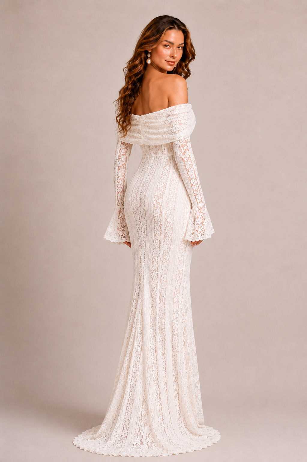Woman wearing a white lace off-shoulder gown with long sleeves on a beige background