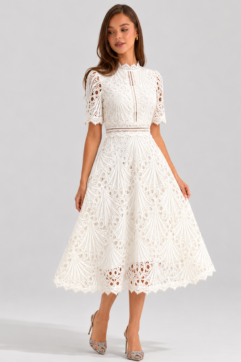 Woman wearing a white lace dress on a gray background