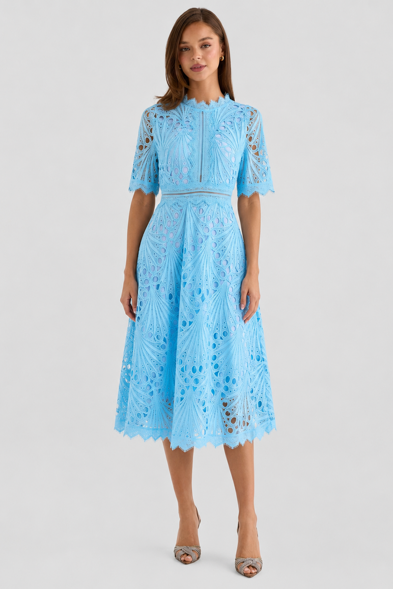Woman wearing a light blue lace dress on a white background