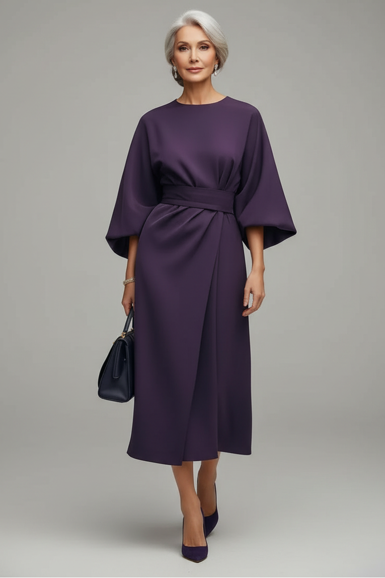 Person wearing a purple dress on a city street