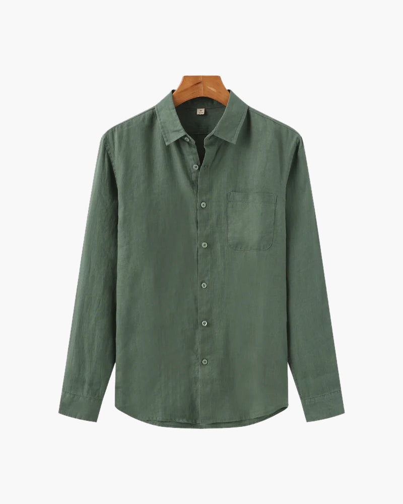 Green shirt on a hanger with a white background