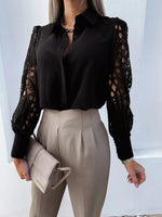Person wearing a black blouse with lace sleeves and beige pants against a light background