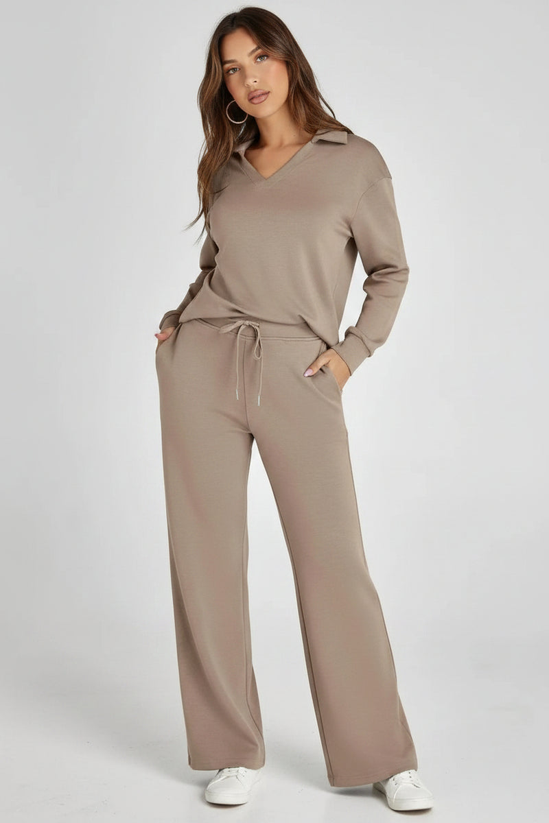 Woman wearing a beige lounge set on a white background