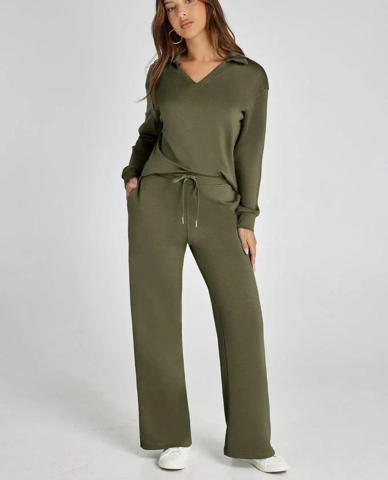 Woman wearing an olive green tracksuit on a white background