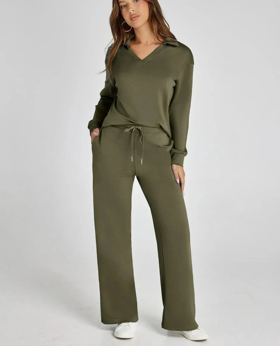 Woman wearing an olive green tracksuit on a white background