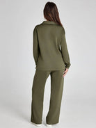 Woman wearing an olive green outfit on a white background