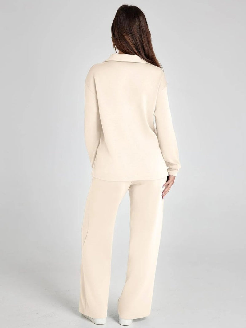 Woman wearing a beige suit on a gray background