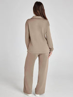 Woman wearing a beige suit on a white background