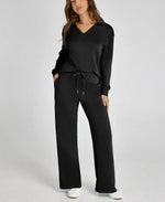 Woman wearing a black outfit with a white background