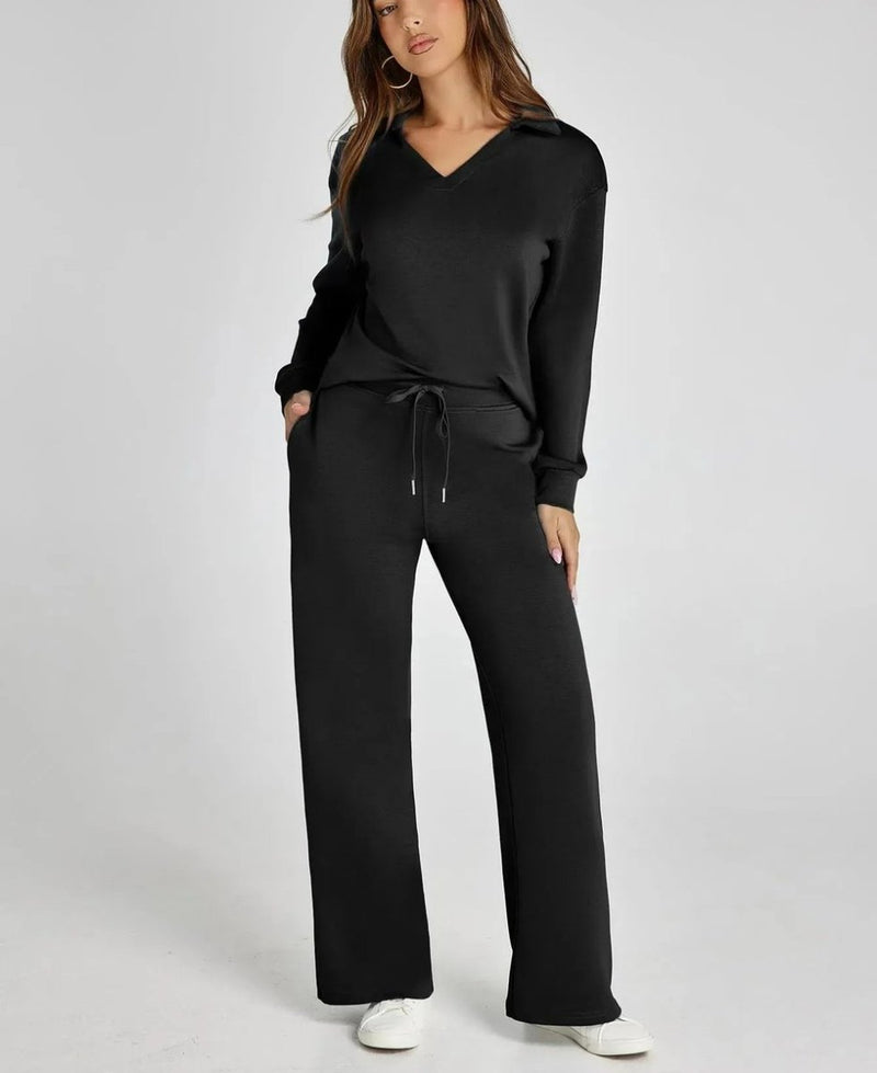 Woman wearing a black outfit with a white background