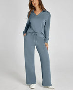 Woman wearing a blue tracksuit on a white background