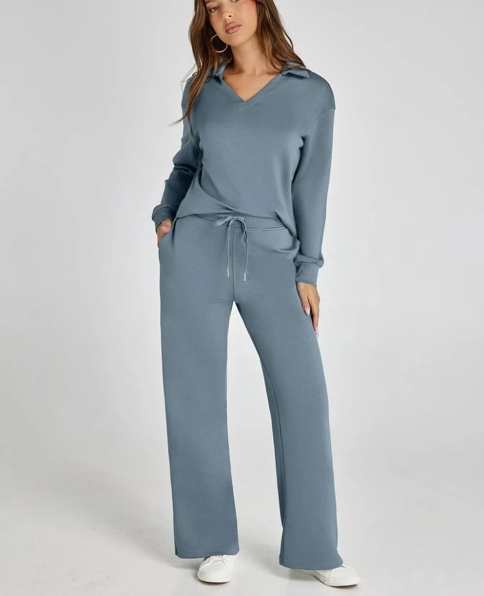 Woman wearing a blue tracksuit on a white background
