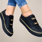 Women’s low top sneakers with gold accents and cushioned sole
