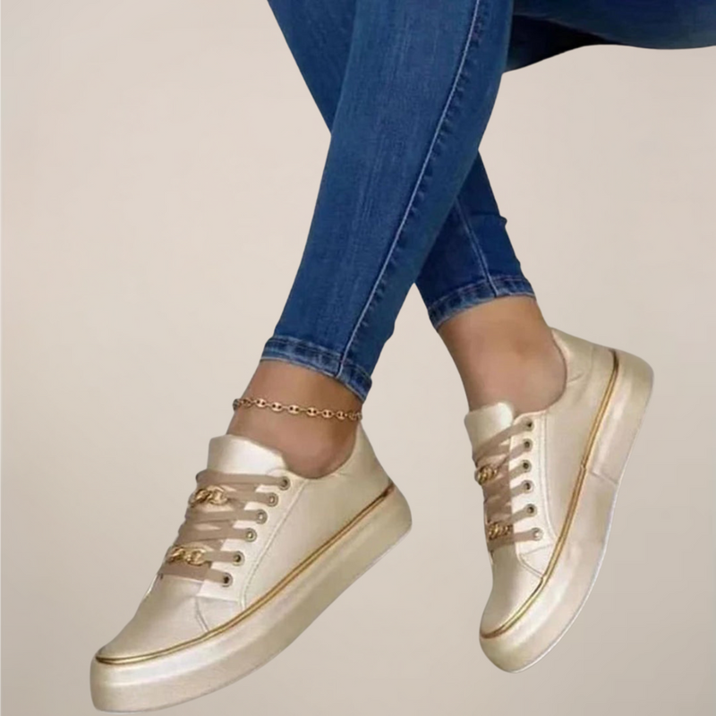 Women’s low top sneakers with gold accents and cushioned sole
