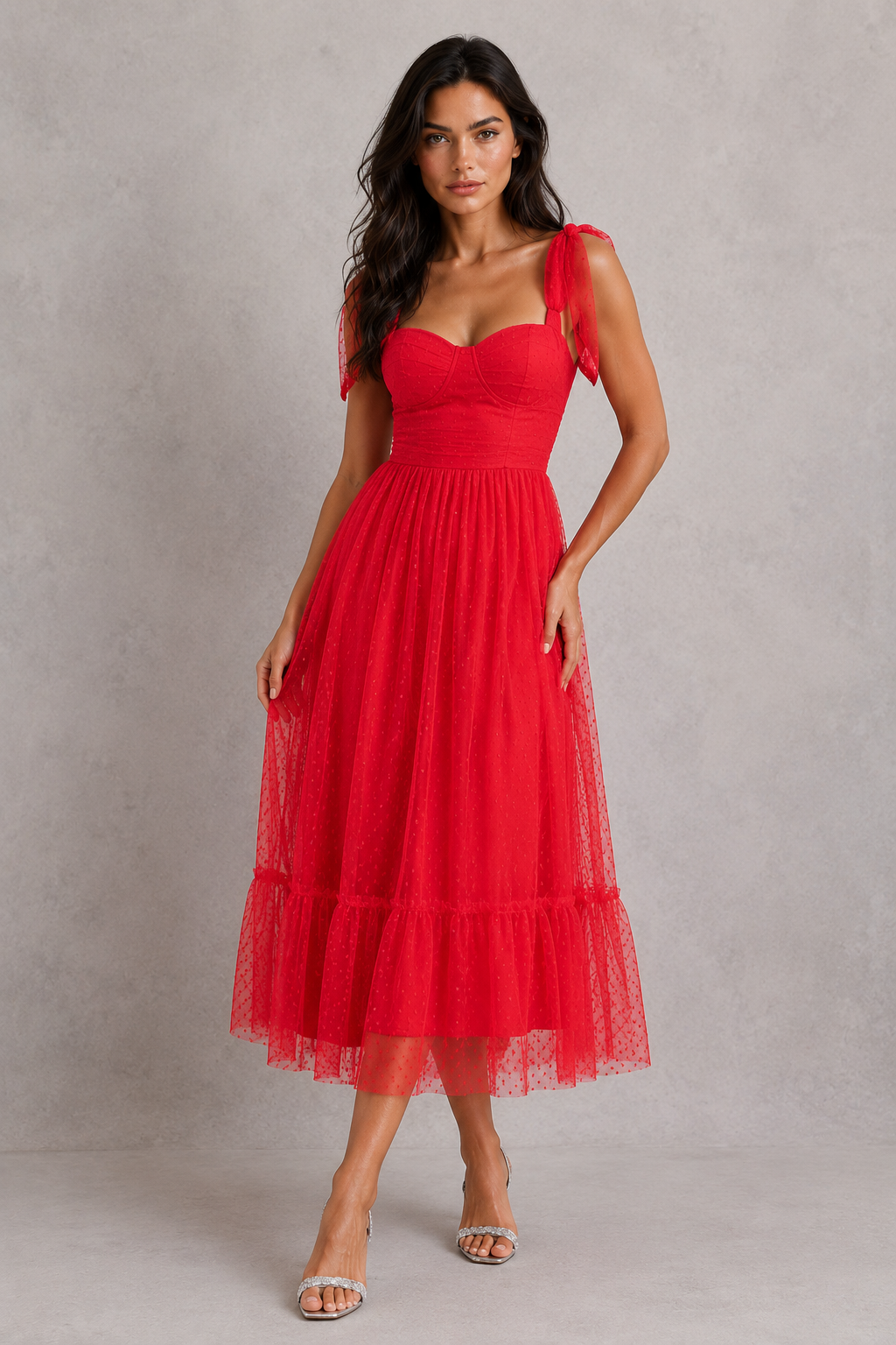 Woman wearing a red dress against a gray background