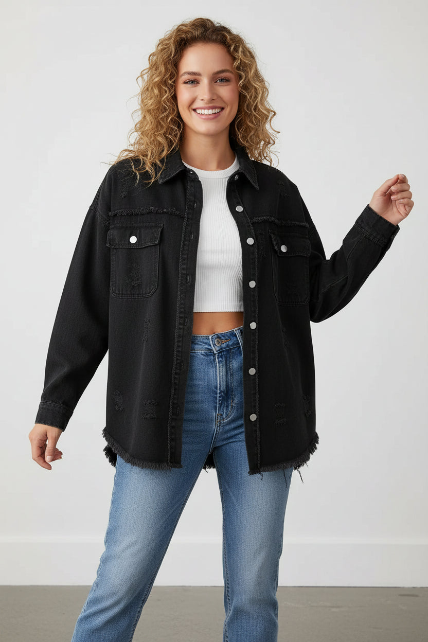 Woman wearing a black denim jacket and blue jeans on a white background