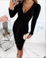 Person wearing a black dress in an elegant room with flowers and candles.