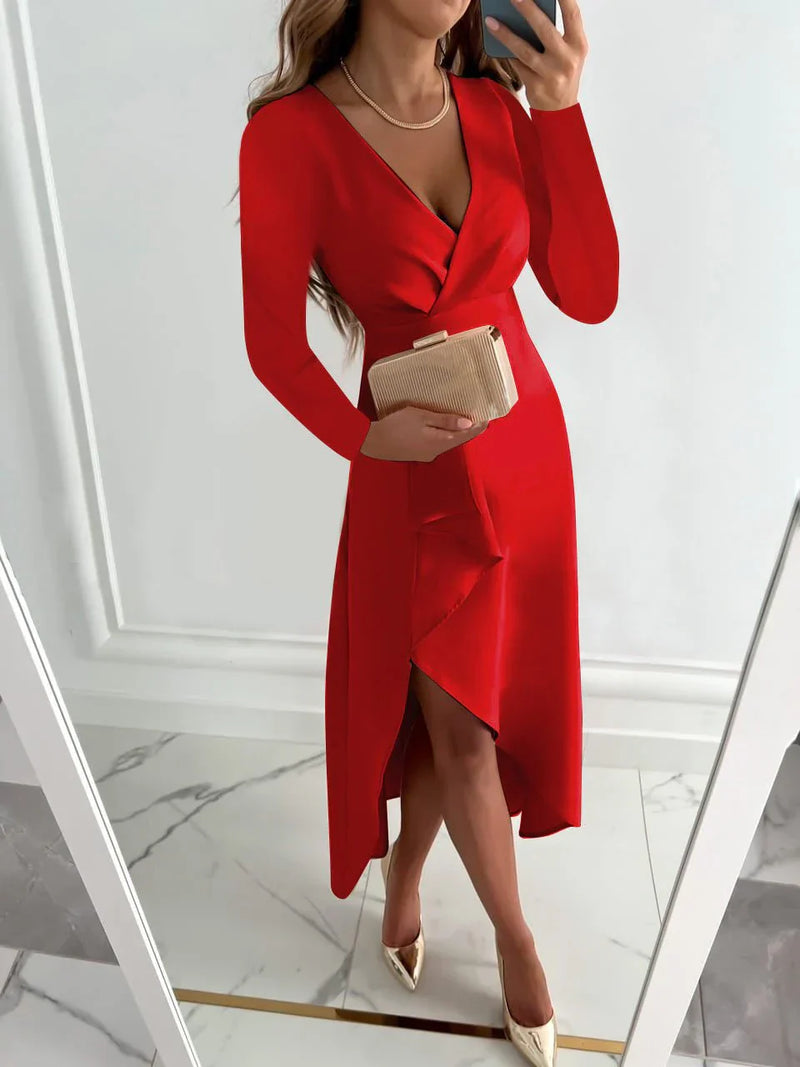 Woman wearing a red dress with a white wall background