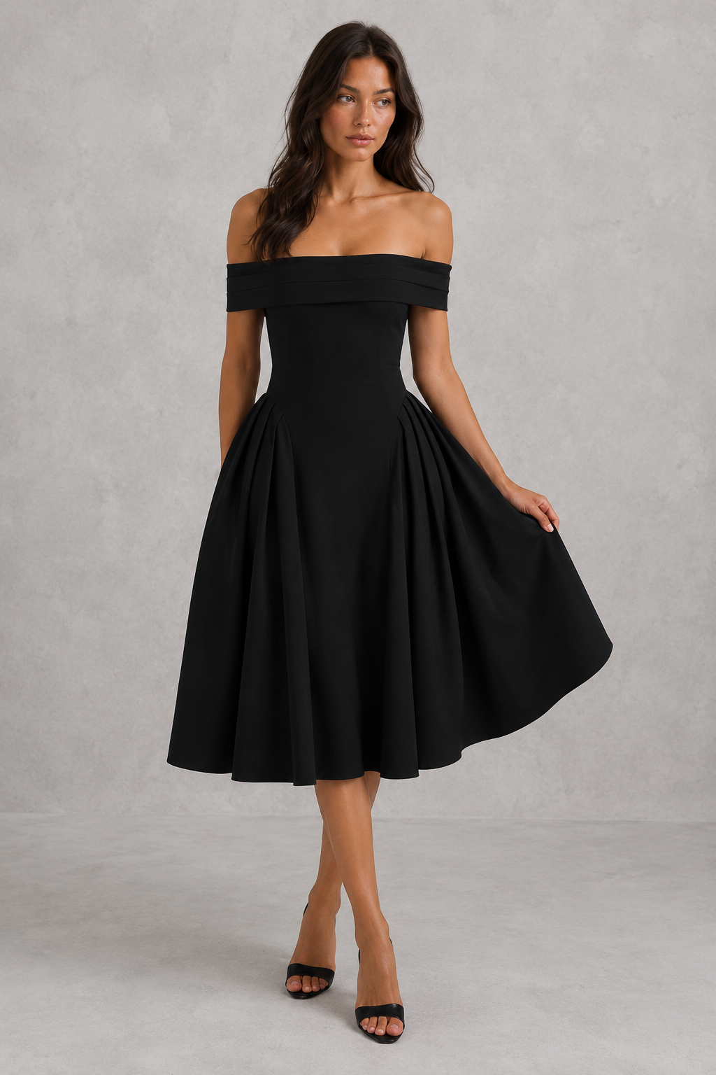 Woman wearing a black off-shoulder dress against a gray background