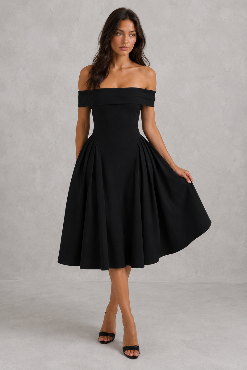 Woman wearing a black off-shoulder dress against a gray background