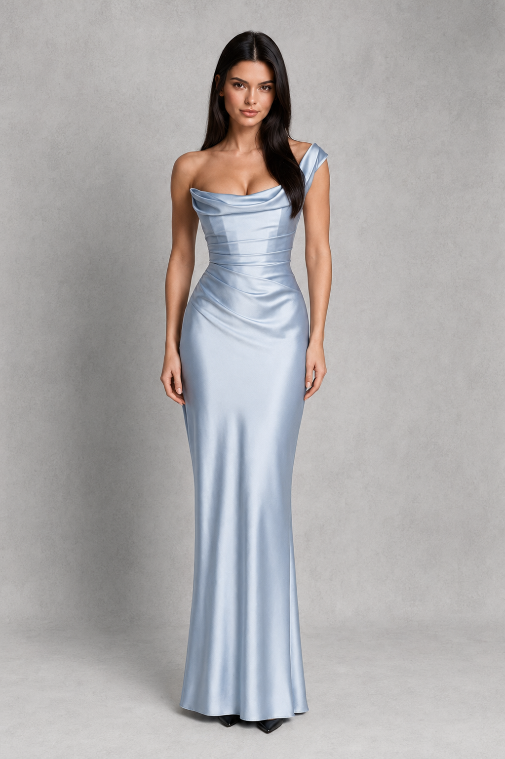 Woman wearing a light blue evening gown against a gray background