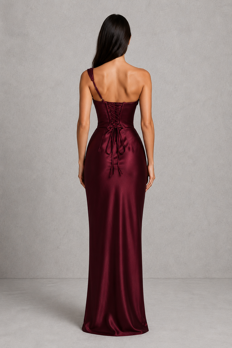 Burgundy satin gown with a tie detail on a gray background