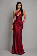 Woman wearing a red evening gown against a gray background