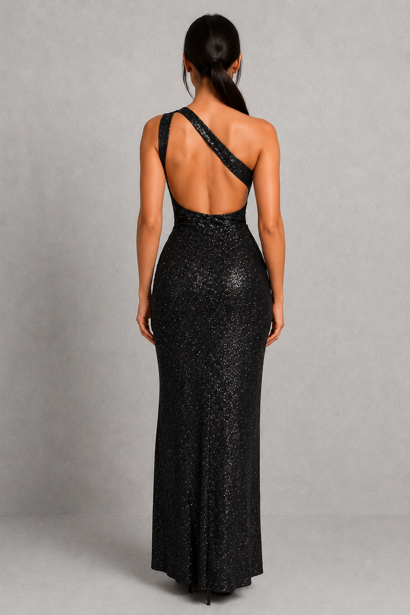 Woman wearing a black sequin evening gown with a gray background