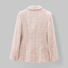 Light pink textured blazer on a gray background