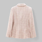 Light pink textured blazer on a gray background