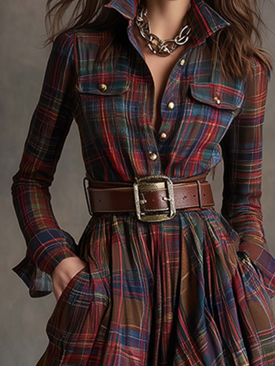 Plaid dress with a belt and gold chain detail on a neutral background