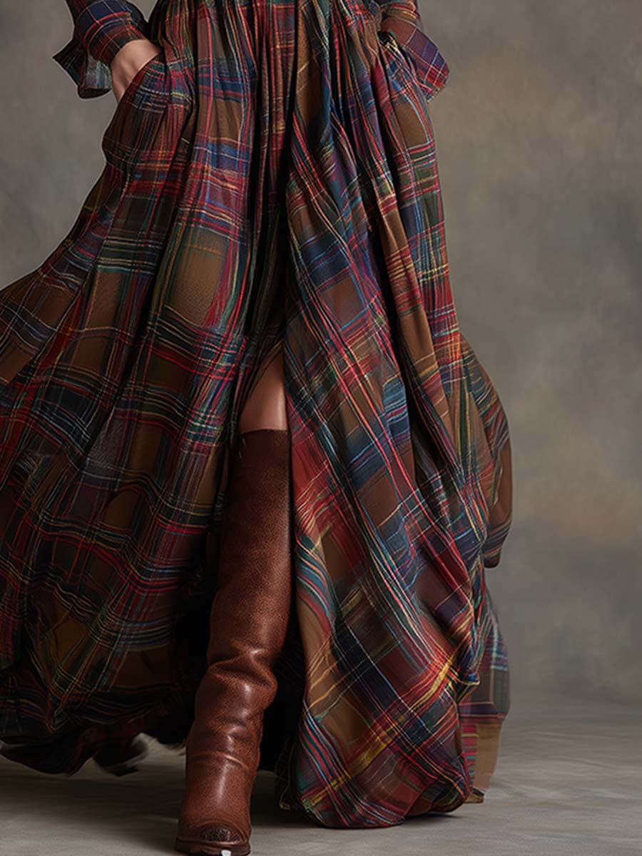 Person wearing a long plaid coat with a plain background