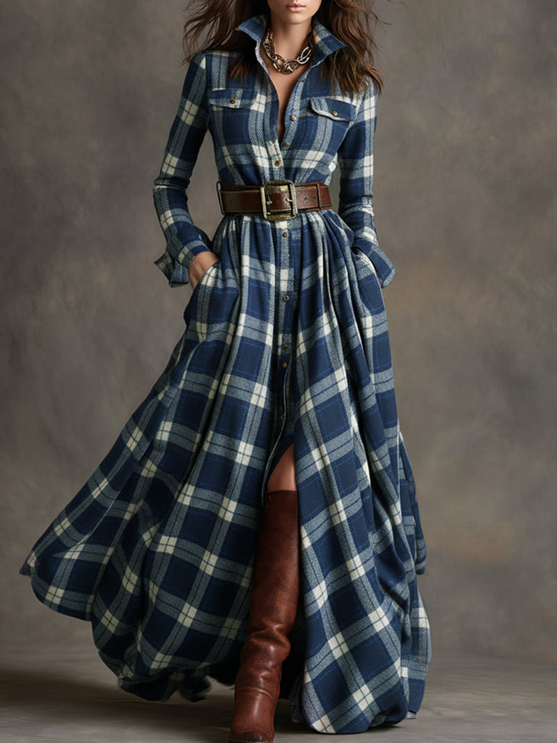 Woman wearing a long blue plaid dress with brown boots against a gray background