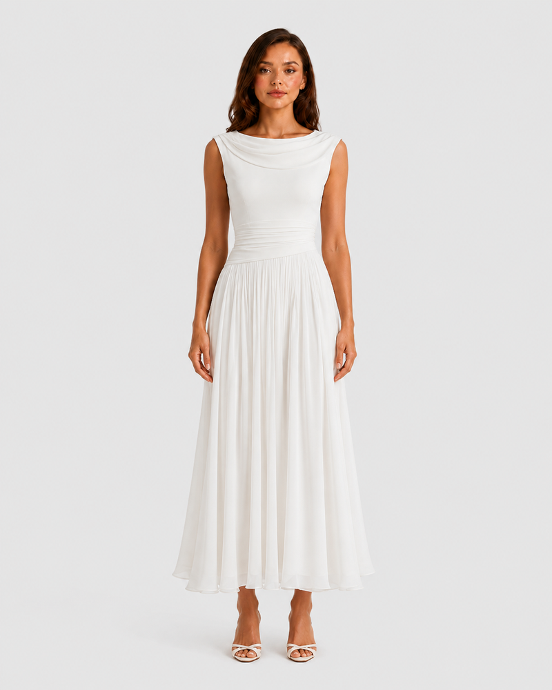 Woman wearing a white dress on a plain background