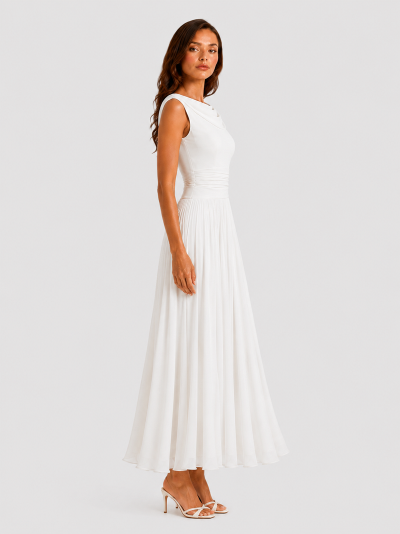 Woman wearing a white dress on a plain background