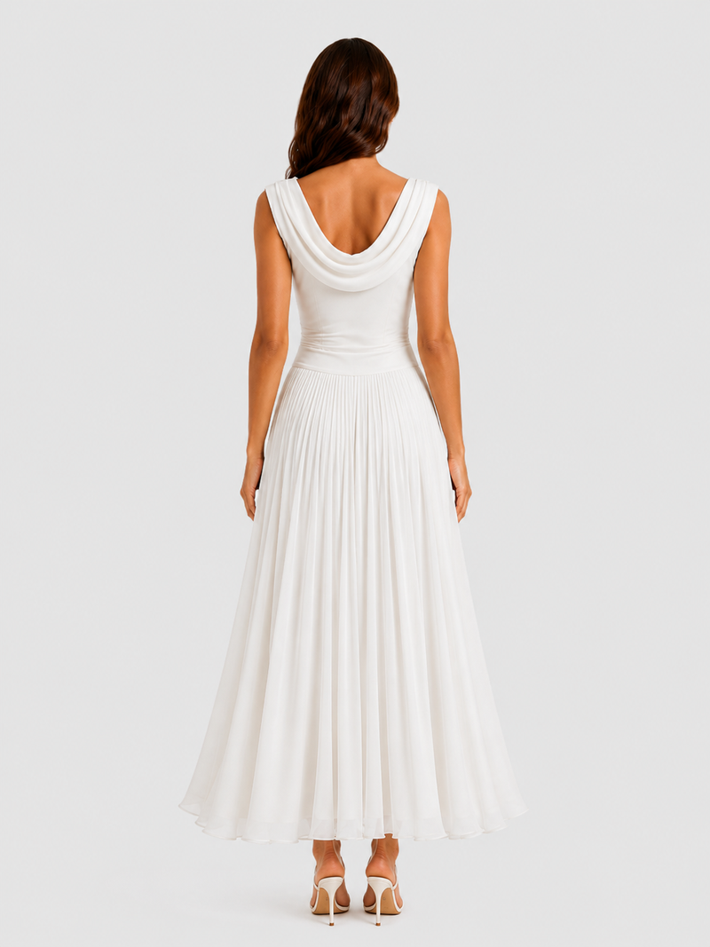 Woman wearing a white sleeveless dress on a plain background