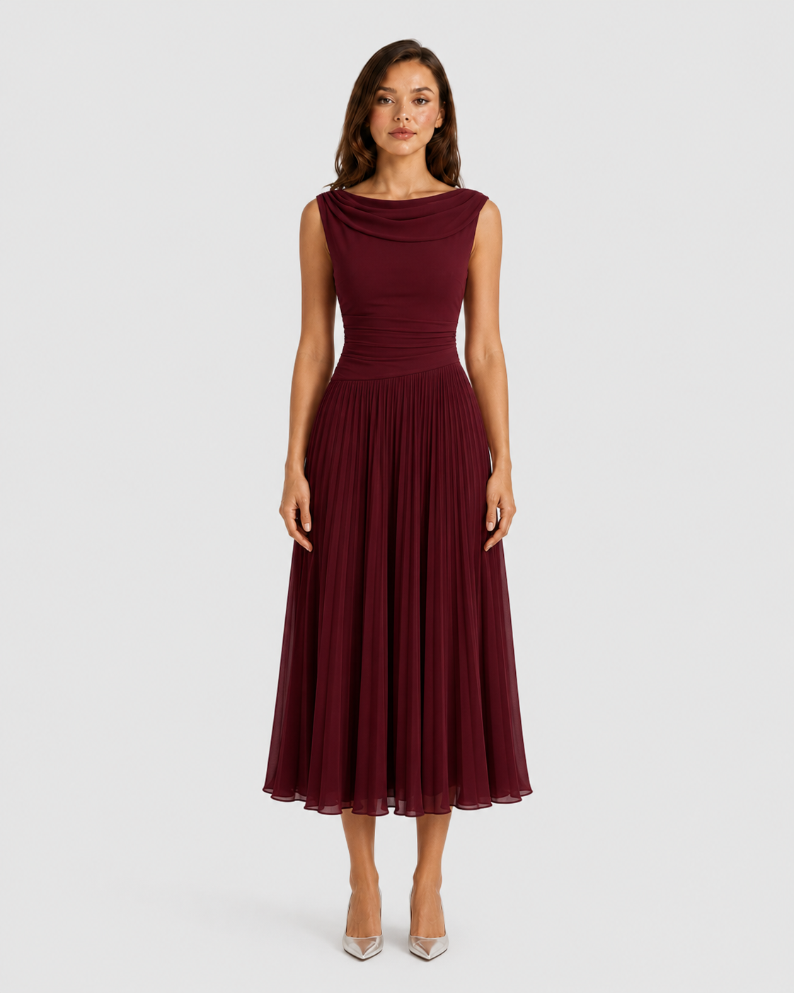 Woman wearing a burgundy dress on a white background